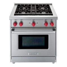 a silver stove top oven with red knobs on the front and side burners