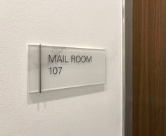 there is a sign on the wall that says mail room 1017