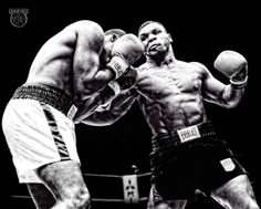 two men in black and white boxing with each other