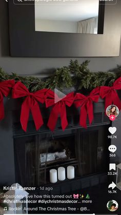 the fireplace is decorated for christmas with red bows