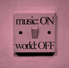 a pink light switch with the words music on and word off written in black ink