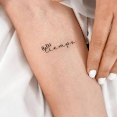 a woman's arm with a tattoo that reads, ella hempa