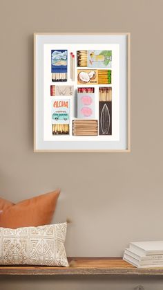 a shelf with some books on it and a pillow next to the wall in front of it