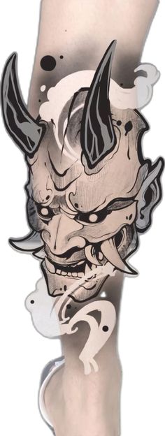 a drawing of a demon with horns and fangs on it's face is shown