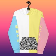 "The Color Block trend is in, and you don't want to miss out. This one of a kind hoodie features blocky pastels and Japanese on either sleeve, which read \"Dream\" and \"Ikigai\".  Ikigai (生き甲斐, 'a reason for being') is a Japanese concept referring to something that gives a person a sense of purpose, a reason for living. The REACTION color block line nods back to fun 80's and 90's designs, but with a modern twist. You won't find this design in a brick and mortar store, trust me. -------------------------------------------------- * 70% polyester, 27% cotton, 3% elastane * Fabric weight: 8.85 oz/yd² (300 g/m²) * Super soft cotton-feel fabric face * Brushed fleece fabric inside * Double-lined hood with design on both sides * Unisex style * Comes with drawstrings * Overlock seams * See size ch White Kawaii Hoodie With Letter Print, White Harajuku Hoodie For Streetwear, Trendy White Patchwork Sweatshirt, White Kawaii Hoodie For Streetwear, White Casual Hoodie With Graphic Design, White Patchwork Sweatshirt For Streetwear, Kawaii Hoodie For Spring Streetwear, Harajuku Style Pink Hoodie With Graphic Print, White Kawaii Sweatshirt For Streetwear