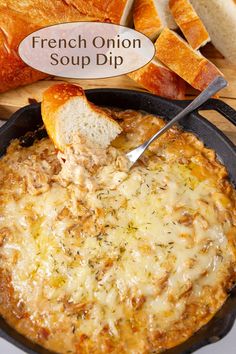 a french onion soup dip in a cast iron skillet with bread on the side