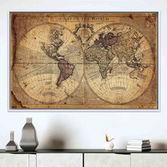 an old world map hanging on the wall