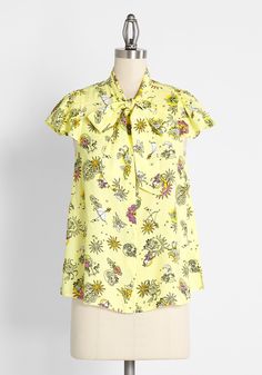 This bright yellow ModCloth namesake label blouse is the perfect anchor piece to take you from spring to summer in the most dapper of ways. Made from a lightweight, flowy rayon-viscose challis fabric, this shirt boasts an exclusive print made-up of zodiac motifs and was inspired by an illustration found on a vintage lunchbox from the 1960s. Don’t worry, we made sure to include every sign and even some extra suns and moons with hints of sunshine yellow, black, and hot pink hues. Featuring flutter Vintage Style Swimwear, Gingham Embroidery, Black And Hot Pink, Casual Dresses Plus Size, The Cardigans, Midi Dress Plus Size, Challis Fabric, Tunic Hoodie, Vintage Swimwear