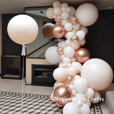 some balloons are in the air near a fireplace