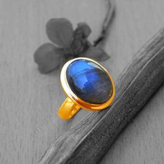 Blue Fire Labradorite gold ring, 14k yellow gold Labradorite ring, Labradorite Cabochon jewelry,romantic gift ring,gold ring, gift for her Labradorite is known for its qualities of "magic" including clairvoyance, psychic powers, telepathy, communication with higher and inner wisdom and guides. Known as a gemstone of adventure, Labradorite is said to help one set off and move swiftly on the inner path and on higher journeys. The 14K yellow solid gold bezel and solid yellow gold ring are both shin Handmade Fine Jewelry Yellow Gold Moonstone Ring, Handmade Yellow Gold Moonstone Ring Fine Jewelry, Handmade Yellow Gold Moonstone Ring, Gold Labradorite Gemstone Rings, Gold Rings With Labradorite Gemstone, Elegant Gold Labradorite Ring, Elegant Gold Rings With Labradorite, Unique Yellow Gold Moonstone Ring Gift, Cabochon Sapphire Ring Gift