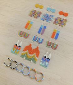 several pairs of beaded earrings are laid out on a table