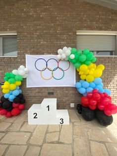 balloons are arranged in the shape of olympic rings