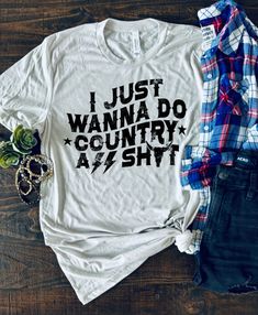 I Just Wanna Do Country Ass Shit Bella + Canvas Unisex Shirt by Boots and Roots Apparel. Embrace your inner country spirit with our "I Just Wanna Do Country Ass Shit" shirt from Boots and Roots Apparel! 🤠🌾 Made with the finest materials and crafted with care in Texas, this Bella + Canvas shirt is as comfortable as it is stylish. Whether you're hitting the backroads, wrangling cattle, or simply enjoying the rural life, this shirt is perfect for those who crave the simple joys of country living. Casual White Tops For Country Events, White Cotton Top For Country Events, White Cotton Tops For Country Events, Country Style White Graphic T-shirt, Country Style White Cotton T-shirt, Casual White T-shirt For Country Concerts, Lake Girl, Cute Country Outfits, Simple Joys