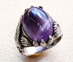 amethyst lace agate oval cabochon purple stone eagle sterling silver 925 men ring all sizes fast shipping oxidized antique classic jewelry Risk free Quality guarantee policy : If you are not satisfied with your item for any reason simply send it to us and you will get a replacement or full refund . no risk ... no cost ... no expenses . please write or choose your size with the order and we will size it for you . Our ring is handcrafted mostly with a few simple tools . but some methods are used i Formal Amethyst Oval Cabochon Jewelry, Formal Amethyst Jewelry, Oval Cabochon, Fine Jewelry Purple Cabochon, Fine Jewelry Amethyst Cabochon, Amethyst Silver Jewelry With Polished Finish, Oval Amethyst Jewelry Collectible, Purple Oval Cabochon Gemstone Jewelry, Purple Oval Cabochon Fine Jewelry, Unique Purple Cabochon Jewelry