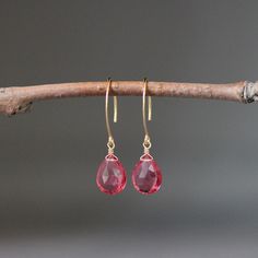 "Stunning faceted Hot Pink Quartz teardrops are wire wrapped with 14k gold filled wire on to 14k gold vermeil long earwires.  Wonderful lightweight statement earrings to wear anytime in the most beautiful bright color!   Pink Quartz teardrops: 10x13mm Total length of earrings: 1 1/2\" As the owner, maker, designer, and curator of this shop, I take great pride in providing you with jewelry that you will love to wear everyday, for special occasions, and for many years to come.  Please read my Shop Pink Briolette Earrings For Gift, Pink Briolette Earrings As Gift, Faceted Briolette Teardrop Earrings, Pink Drop Earrings With Ear Wire, Wire Wrapped Teardrop Drop Earrings, Teardrop Wrap Earrings As Gift, Teardrop Wrap Earrings For Gift, Pink Briolette Earrings For Pierced Ears, Pink Wire Wrapped Teardrop Earrings