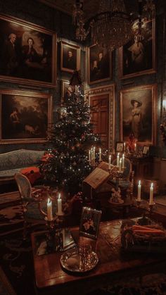 a living room with a christmas tree and pictures on the wall