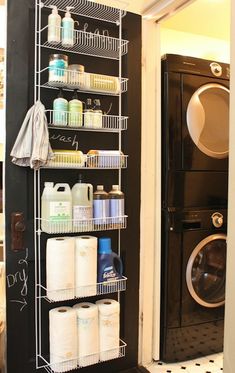 a washer and dryer sitting next to each other in front of a door