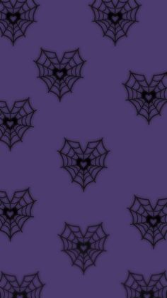 a purple background with black spider webs on it