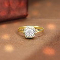 a diamond ring sitting on top of a table