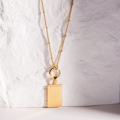 A perfect mix of modern beauty and fun, this personalized initial matrix pendant will get plenty of second looks. Available in gold, rose gold or silver, just pick the color that matches your mood. Engrave this stunning pendant with the initial of your family, littles, or besties! Be fabulous day or night with this stunning necklace. Give as a gift or treat yourself. Available in 14k gold plated, rhodium plated or 14k rose gold plated brass Pendant size: 3/4" by 1/2" 20" or 30" satellite chain o Rectangular Pendant Jewelry With Initials For Everyday, Everyday Rectangular Pendant Jewelry With Initials, Everyday Jewelry With Initials On Rectangular Pendant, Luxury Personalized Sterling Silver Charm Necklace, Personalized Rectangular Pendant Charm Necklace, Rose Gold Charm Necklace With Initial Pendant, Tarnish Resistant White Gold Charm Necklace With Initial Pendant, Rose Gold Initial Necklace With Charms For Gift, Luxury Pendant Charm Necklace For Everyday