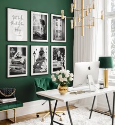 a home office with green walls and pictures on the wall above it, along with a white desk