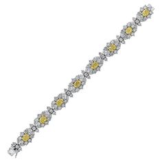 Bracelet composed of platinum featuring yellow and white diamonds. There are approximately 16.50 carats of round and marquise shaped white diamonds and 8.39 carats of oval shaped yellow diamonds. All eight of the yellow diamonds are accompanied by GIA reports, varying from natural fancy yellow to natural fancy intense yellow, and have a clarity range of VVS1 to SI1. The white diamonds are G-H color and VS clarity. The bracelet measures 7 inches in length and 1/2 inch wide. Cultured Pearl Bracelet, Platinum Bracelet, Marquise Shape Diamond, Expensive Jewelry Luxury, Yellow Diamonds, Modern Bracelets, Fancy Yellow Diamond, Diamond Jewelry Designs, Expensive Jewelry