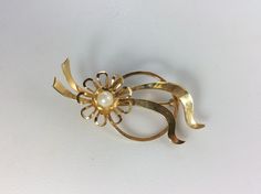 Vintage Pin Brooch Gold Toned Circle Ribbon And Flower Design With Faux Pearl Used Elegant Gold Brooches For Spring, Formal Flower Brooch For Spring, Formal Spring Flower Brooch, Formal Spring Flower Brooches, Vintage Pins, Pin Brooch, Flower Design, Flower Designs, Faux Pearl