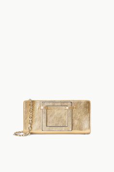 The Shirley Convertible Clutch is the newest clutch inspired by the beloved Shirley Bag, updated with a retractable square handle and a chain shoulder strap. This style features a top zip and an interior center zip pocket. Snake-embossed leather clutch 9.13" W x 4.12" H x 2.9" D Detachable chain strap Everyday Rectangular Wallet On Chain With Gold-tone Logo, Luxury Rectangular Wallet On Chain With Gold-tone Logo, Designer Wallet On Chain With Gold-tone Hardware, Evening Rectangular Shoulder Bag With Gold-tone Logo Plaque, Chic Rectangular Bag With Gold-tone Logo Plaque, Chic Rectangular Shoulder Bag With Gold-tone Logo, Chic Wallet On Chain With Gold-tone Logo For Everyday, Chic Formal Clutch With Gold-tone Logo Plaque, Modern Gold Evening Bag With Chain Strap