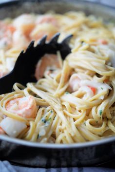 pasta with shrimp and scallops in a skillet