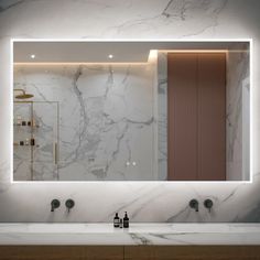 a bathroom with marble counter top and large mirror above the sink, along with two faucets