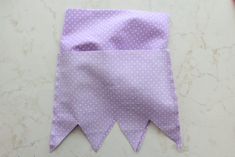 a purple and white polka dot fabric on a table