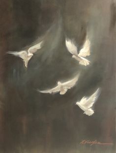 three white birds are flying in the sky