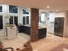 an empty kitchen and living room are being remodeled