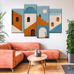 a living room with three paintings on the wall