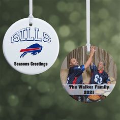 two ornament hanging from strings that say, bills seasons greetings the walker family