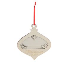 a christmas ornament hanging from a red ribbon on a white background with the words christmas