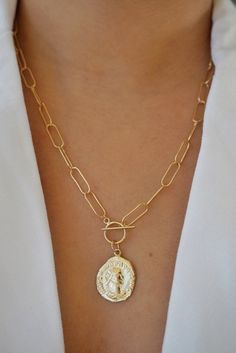 Unique and a showstopper! Looks amazing alone or stacked with daintier layers. Made with 14k gold filled materials, daily wear is recommended! Wear the clasp in the back for a solid chain look. -- 14k gold filled 20'' chain length Handcrafted Roman coin -- --PROCESSING-- Item is made to order and may take up to 2 weeks to ship. --QUALITY IS EVERYTHING-- You're investing in a piece that will last! Gold filled is NOT the same thing as gold plated, nor is it 'overlay' or 'vermeil'. After years of e Chunky Gold Bracelet, Toggle Clasp Necklace, Gold Medallion Necklace, Layered Coin Necklace, Gold Link Necklace, Necklace Outfit, Chain Necklace Gold, Gold Coin Necklace, Gold Link Chain