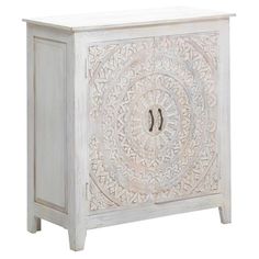 a white cabinet with an intricate design on the front and side doors, it has two drawers