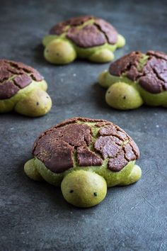 chocolate turtle cookies with green frosting on top