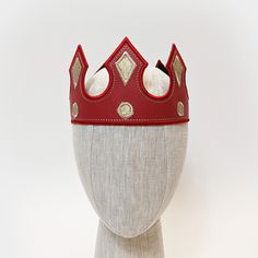 These medieval crowns are great for any royal themed event or anyone trying to finish a king, queen, prince, or princess costume. Each crown is made from vinyl leather with embroidered edges. Crowns have adjustable hook/loop fastening in the back to fit a range of sizes (one size fits most). Choose from 15 color options.Plain Crowns - Solid color crowns with matching stitching along the edges for a clean finishCrown with Jewels - Choose your crown color and then we will provide an additional lay Adjustable Medieval Costume Accessories For Cosplay, Adjustable Tall Crown Costume Accessories For Parties, Medieval Crown Headpiece For Festival, Medieval Crown Style Festival Headpiece, Medieval Festival Crown Headpieces, Adjustable Crown Costume Hat For Costume Party, Adjustable Tall Crown Headpiece For Cosplay, Adjustable Crown For Costume Party, Carnival Crown Costume Hat