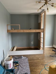 the room is being remodeled and ready to be used as a loft bed with ladders