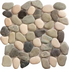 a pile of rocks sitting on top of a white floor next to each other in different colors