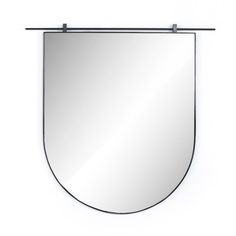 a mirror hanging on the wall with a metal bar in front of it and a white background