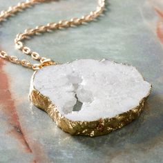 "Purchase the Signature Color Shop White Druzy Quartz Pendant By Bead Landing™ at Michaels. com. Lend an exquisite touch to your favorite necklace with this white quartz pendant by Bead Landing. Lend an exquisite touch to your favorite necklace with this white quartz pendant by Bead Landing. You can also use this druzy quartz pendant as a fancy charm for a DIY bracelet, anklet and more. Details: White 2.56\" x 1.81\" 1 pendant Quartz and copper | Signature Color Shop White Druzy Quartz Pendant B Nature-inspired White Necklace With Natural Stones, Nature-inspired White Jewelry With Natural Stones, White Spiritual Jewelry With Large Pendant, Nature-inspired White Necklaces For Healing, White Nature-inspired Necklaces For Healing, Nature-inspired White Beaded Jewelry, Nature-inspired White Pendant Jewelry, White Pendant Jewelry For Crafting, Nickel-free White Nature-inspired Jewelry