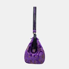 Crafted with carpet and luxurious lambskin leather, this semi-structured shoulder bag stands on its own for easy access, and it's closed with invisible magnets integrated within the frame complemented by cowhide leather patches for added flair.This is a design modified from the top handle purse by adding 4.50" to the handle drop, the handle drop of this purse is 9.50" which is perfect for shoulder carry. Overall measurements:• Bottom Width: 12-1/2"• Top Hinge Width: 11"• Depth: 4-3/4"• Height: 6 Purple Shoulder Bag, Velvet Purple, Structured Shoulder, Large Travel Bag, Work Tote Bag, Burnout Velvet, Mens Travel Bag, Bag Stand, Work Bags