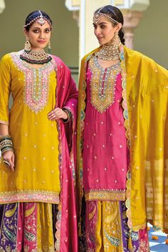 This Festive Multicolor Pink Embroidered Silk Lehenga Set showcases Resham, Zari, Dori and Sequins Work on both the kameez and skirt. The heavily embellished silk skirt bottom and top are lined with poly shantoon for enhanced elegance and comfort. Complete with a full size 2.5 yard embroidered silk dupatta, this traditional Lehenga set is ideal for formal occasions, including sangeet, jaago, parties, weddings, and other special events. Shirt: premium silk with embroidery work Skirt: premium silk Traditional Pink Dola Silk Dress, Diwali Sharara With Multicolor Embroidery And Traditional Drape, Pink Traditional Wear With Mirror Work For Transitional Season, Diwali Multicolor Embroidered Sharara With Traditional Drape, Transitional Pink Traditional Wear With Mirror Work, Pink Dola Silk Straight Kurta Dress, Pink Embroidered Raw Silk Traditional Wear, Multicolor Chinon Traditional Wear, Diwali Multicolor Embroidered Sharara