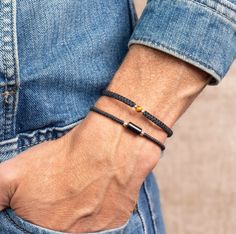 Mens Macrame Beaded Bracelet, Single Tiger Eye Bead on the model, black paired with simple macrame onyx bracelet Orange Peel Jewelry, Mens Macrame Bracelet, Colombian Jewelry, Modern Bracelet, Wax Cord Bracelet, Simple Macrame, Filigree Bracelet, Surfer Bracelets, Miyuki Bracelet