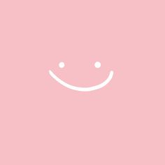 a pink background with a smiley face drawn on it