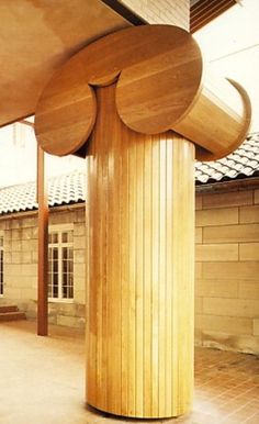 a large wooden structure sitting in the middle of a courtyard