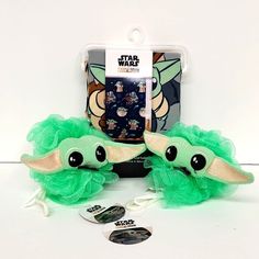 star wars yoda plush toy with green tulle skirt and headphones on display